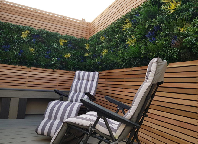 tiny garden with cedar battens and artificial green walls